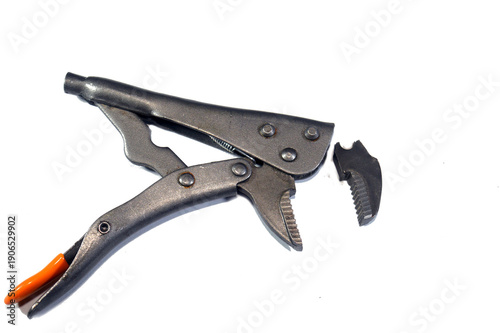 broken Locking jaw pliers known as Vise-Grips or mole wrenches, versatile, adjustable hand tools featuring a locking mechanism that clamps onto objects with high pressure