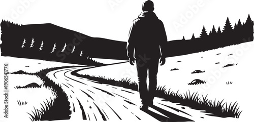 Man walking alone on a winding road in winter landscape