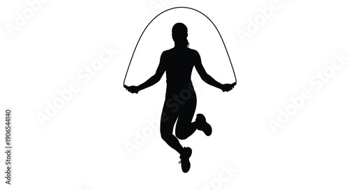 Silhouette of a person mid jump while skipping rope