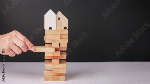Canvas Print Hand careful removing wooden block from tower metaphor for risk control maintain