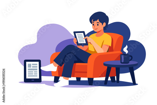 Young man relaxing in armchair reading on tablet computer.