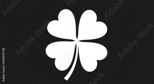 White four leaf clover on black background for luck and st patrick's day concepts