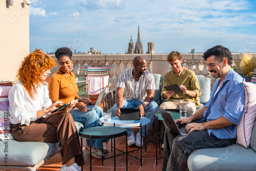 Photography Diverse team brainstorming on a modern rooftop terrace