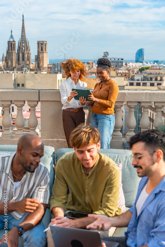 Photography Diverse colleagues collaborating on rooftop during business meeting break