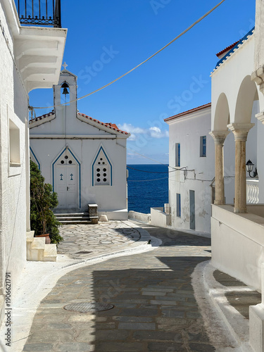 Photos street in oia town andros greece