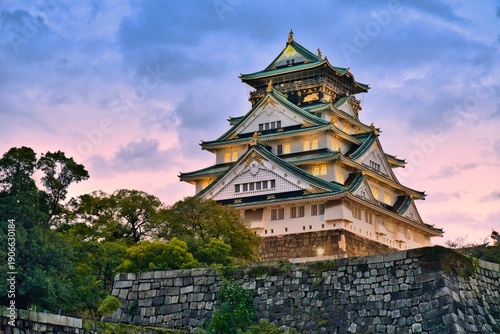 Osaka Castle Main Tower Illuminated at Blue Hour from Royal Boat Pier with Pink Sunset Sky
