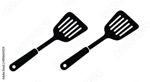 Two black spatulas shown against a plain white background