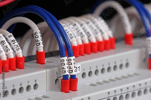 Fotografie Marking electrical wiring wires with thermally printed nylon tape