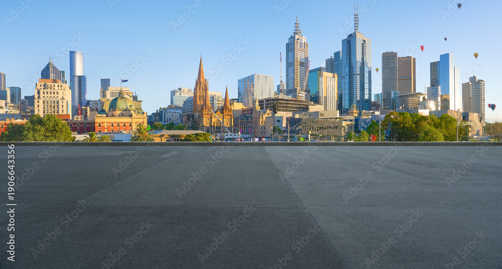 Obraz premium Melbourne city skyline with flying hot air balloons