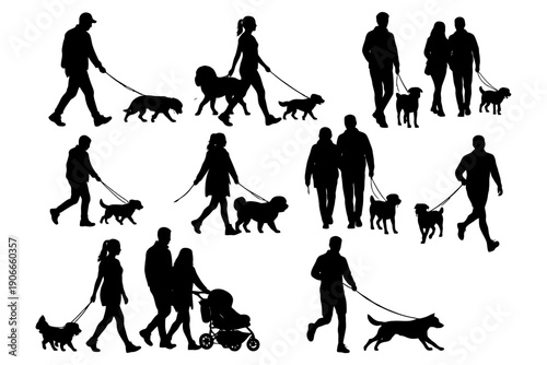 Silhouettes of people and dogs walking together.