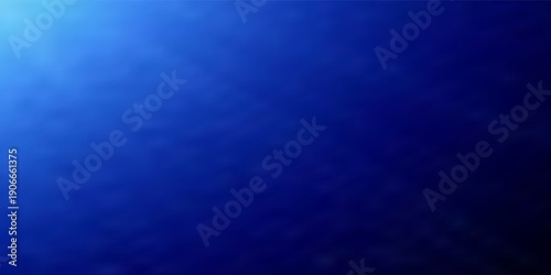 Rich blue light rays casting over black background. Professional stage lighting effect. Soft radiant glow with subtle dust texture in dark room.