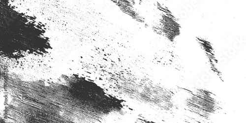 Dark grey textured brush strokes and speckles on white background abstract grunge distressed