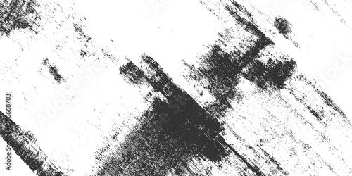 Dark charcoal textured brush strokes and speckles on a white background abstract black