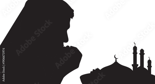 Muslim woman praying towards mosque silhouette with copy space