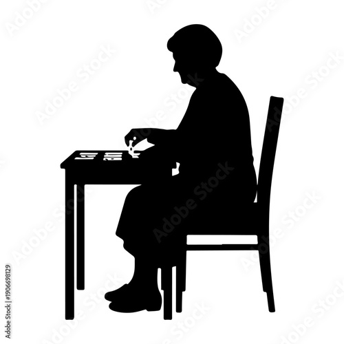 Elderly woman sitting at table black silhouette isolated