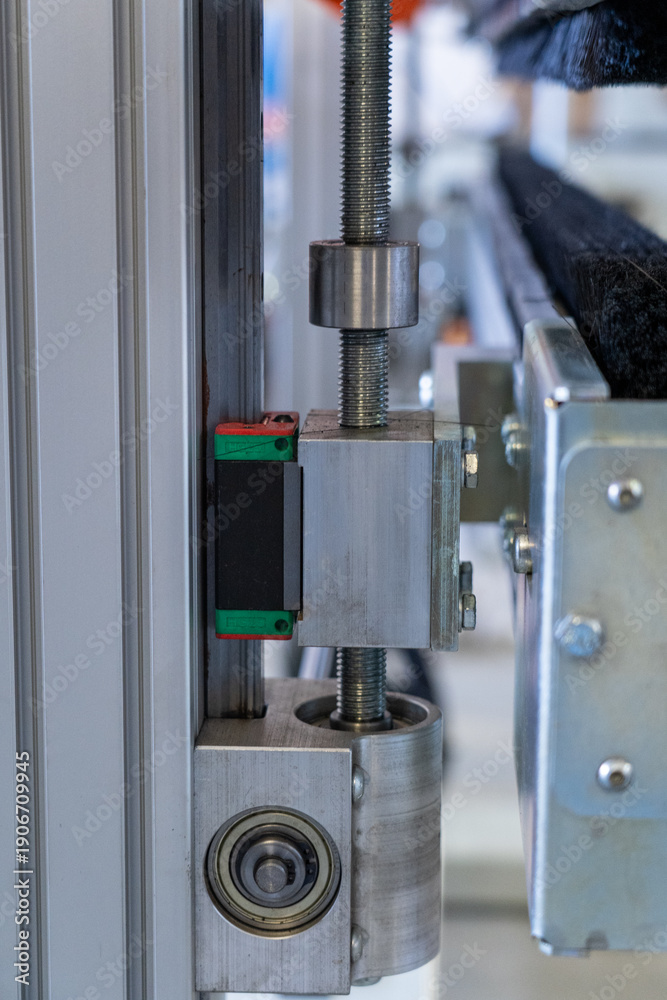Naklejka premium Red Linear Block on Threaded Rod Conveyor System