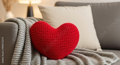 Cozy Valentine's Day Interior with Red Knitted Heart Pillow on Grey Sofa