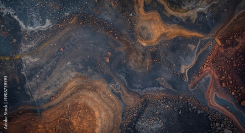 Detailed stratification of soil and iron ore concentrations visible in an open pit mining site