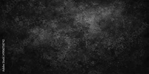 A dark and vintage black and white grunge background features a rough textured stone wall surface with aged gray paint and a dirty concrete pattern for a blank backdrop design