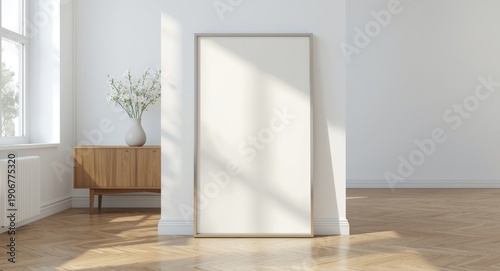 Empty vertical picture frame on parquet floor in modern Scandinavian living room with vase and console