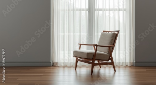 Close shot of a singular chair placed close to a window in a neat space