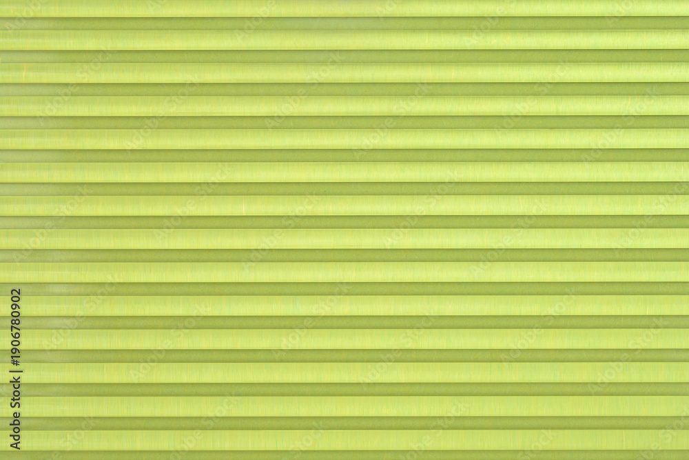 Obraz premium A macro shot of a light green transparent plastic surface with a horizontal ribbed pattern creating a clean and modern industrial background