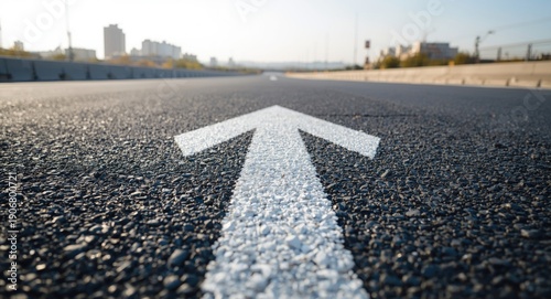 Coarse asphalt texture showcasing fresh white directional lines