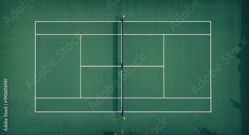 Aerial shot showing symmetrical tennis court design and net placement