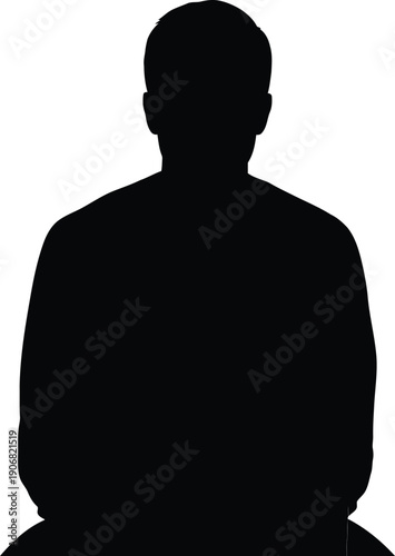 Silhouette of a person sitting with hands on knees viewed from the front in darkness