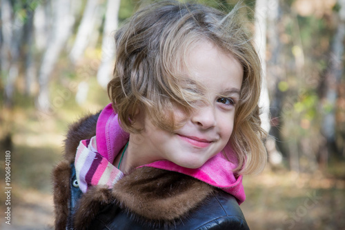 Portrait of laughing young girl in a park