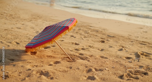 Colorful sunshade on sandy ...