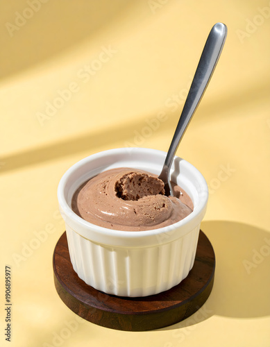Creamy Chocolate Dessert in Ceramic Bowl on Wooden Plate
