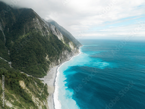 Wallpaper Mural Stunning aerial view of a coastal mountain landscape with blue ocean waves. Coastline of Hualien County, Xiulin Township, Taiwan Torontodigital.ca