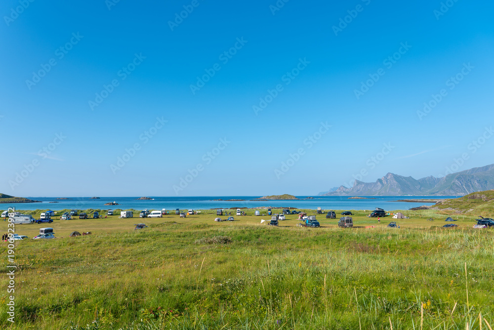 Fototapeta premium Campsite at Yttersand beach near Fredvang. The Norwegian Sea in the background.. Lofoten in Norway.