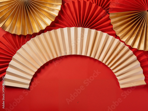 Festive Red and Gold Paper Fan Decoration for Celebrations