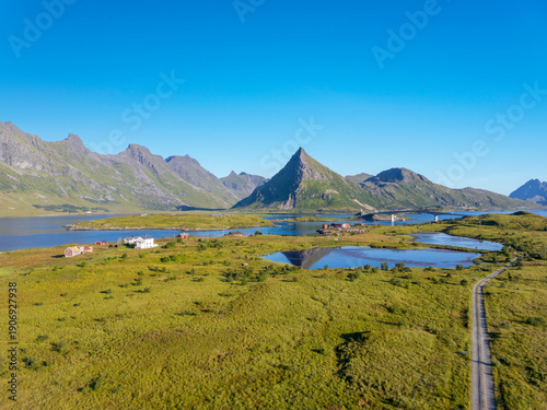 Aerial view near Fredvang with a view of the Fredvang Bridges and the distinctive peak of Volandstind. Lofoten, Norway