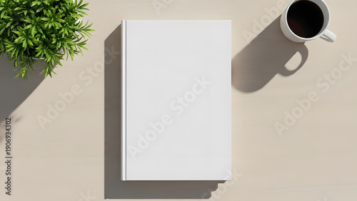 Blank book cover mockup with plant and coffee cup on wooden table