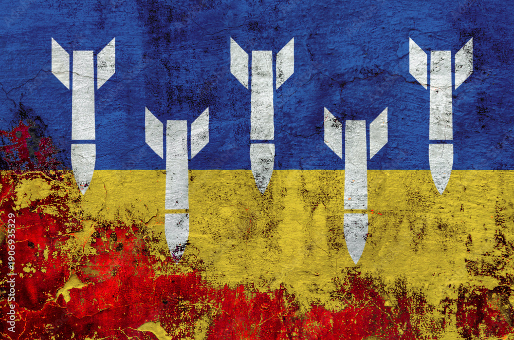 Fototapeta premium military rockets on the background of the national flag of Ukraine on the wall during the war
