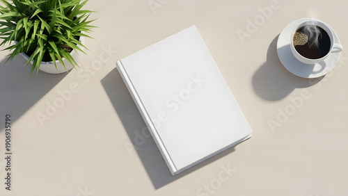 Perspective view blank book cover mockup on light beige surface with green plant and coffee saucer