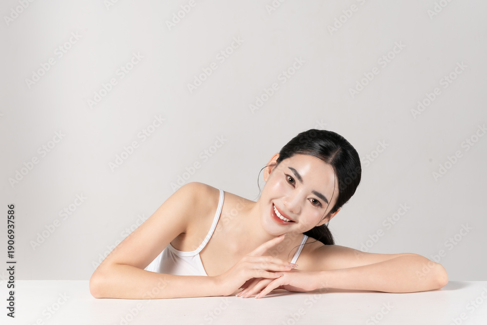 Fototapeta premium Portrait of beautiful young asian woman with healthy face skin and body skin, isolated on white background, for make-up product, skincare and cosmetic concept. 