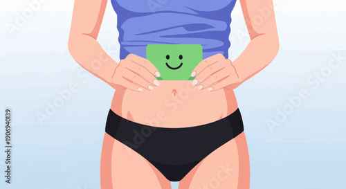 Person holding a green card with a smiley face over their stomach