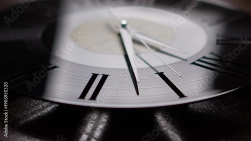 Minimalist vinyl record wall clock with moving hands