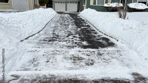 Shoveled Driveway After Snow with Parked Car Visible