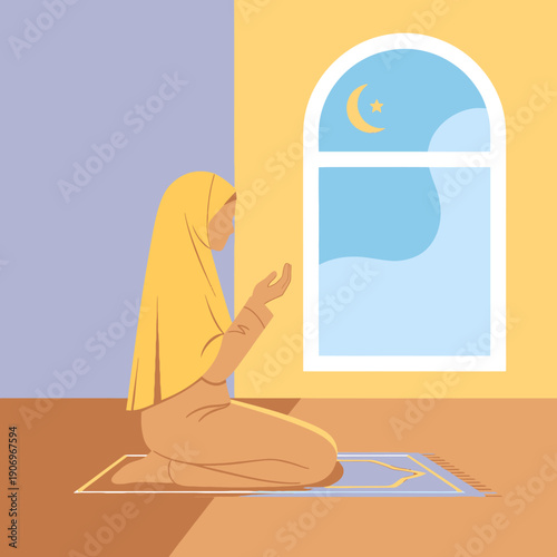 Woman praying on a mat indoors.