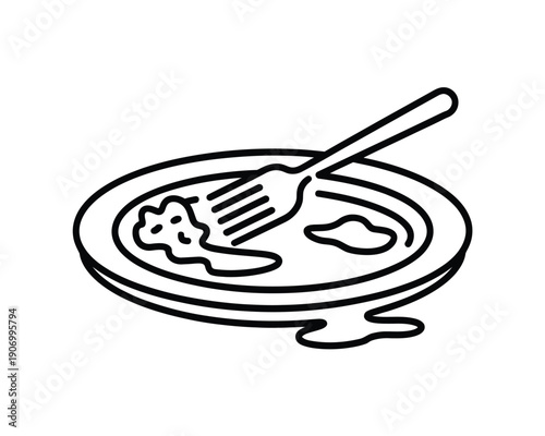 A dirty plate with a fork rests after a meal is finished.