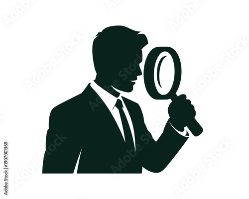 A silhouette of a man in a suit holding a magnifying glass