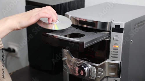 Knocks, rustling the CD tray of a music system when inserting a CD