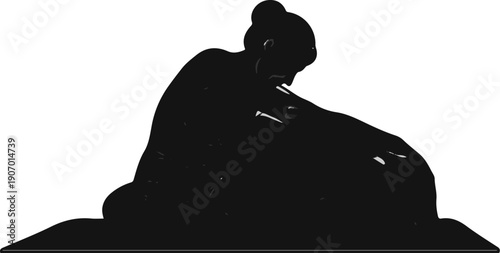 Silhouette of a figure in a dark, somber pose, head bowed over