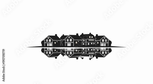 Silhouette of houses reflected in water