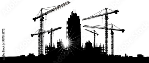 Silhouette of cranes and buildings under construction with sunburst
